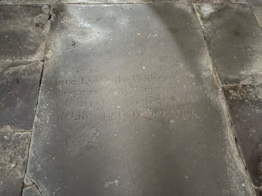 Ledger stone by entrance